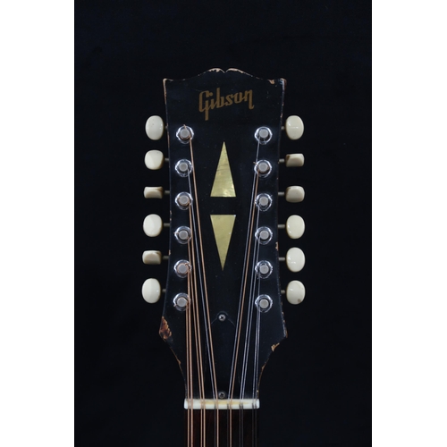 386 - GIBSON A vintage 1960's Gibson B-45 12 string acoustic guitar with natural finish and  tortoise shel... 