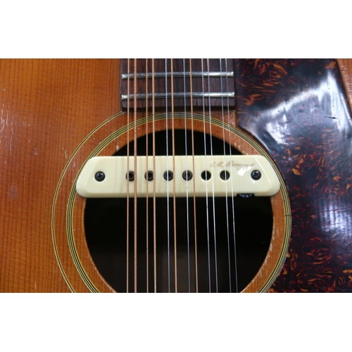 386 - GIBSON A vintage 1960's Gibson B-45 12 string acoustic guitar with natural finish and  tortoise shel... 