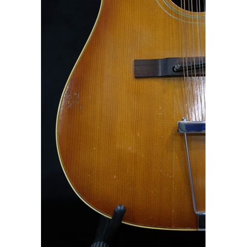 386 - GIBSON A vintage 1960's Gibson B-45 12 string acoustic guitar with natural finish and  tortoise shel... 