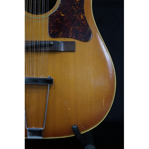 386 - GIBSON A vintage 1960's Gibson B-45 12 string acoustic guitar with natural finish and  tortoise shel... 