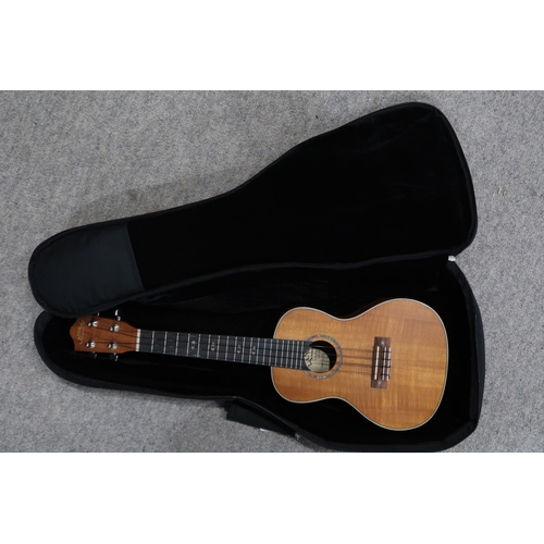 389 - LANAKAI A Lanakai ukulele model CK-C with a padded travel bag.This Instrument is from the estate of ... 