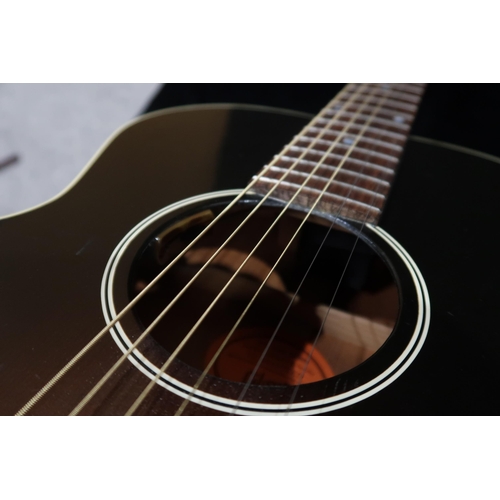 392 - GIBSON a Gibson Blues Tribute electro acoustic six string guitar serial number 12055077 with a Gibso... 