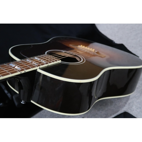 395 - GIBSON a Gibson Southern Jumbo electro acoustic six string guitar in brown burst with a tortoise she... 