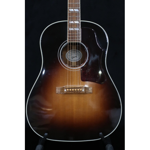 395 - GIBSON a Gibson Southern Jumbo electro acoustic six string guitar in brown burst with a tortoise she... 