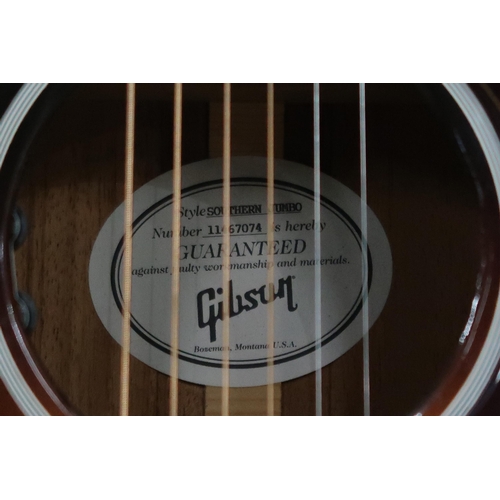 395 - GIBSON a Gibson Southern Jumbo electro acoustic six string guitar in brown burst with a tortoise she... 