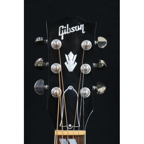 395 - GIBSON a Gibson Southern Jumbo electro acoustic six string guitar in brown burst with a tortoise she... 