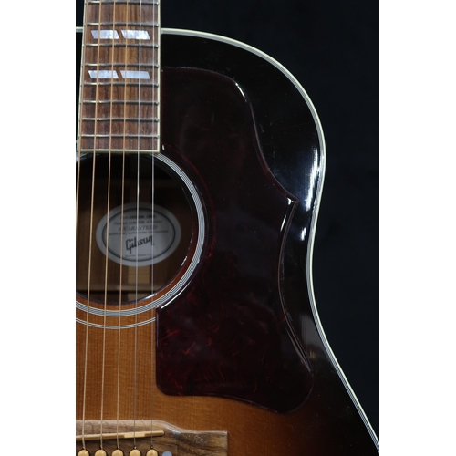 395 - GIBSON a Gibson Southern Jumbo electro acoustic six string guitar in brown burst with a tortoise she... 