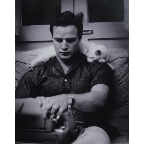 418 - A lot comprising four framed black and white photographic prints with a young Marlon Brando, Freddie... 