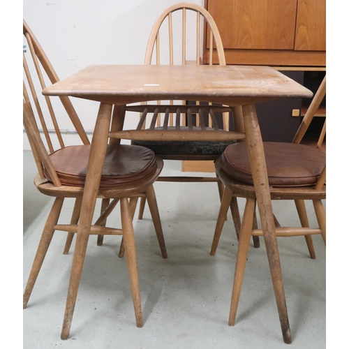 58 - A mid 20th century Ercol elm and beech model 395 table with square top over railed lower tier on sha... 