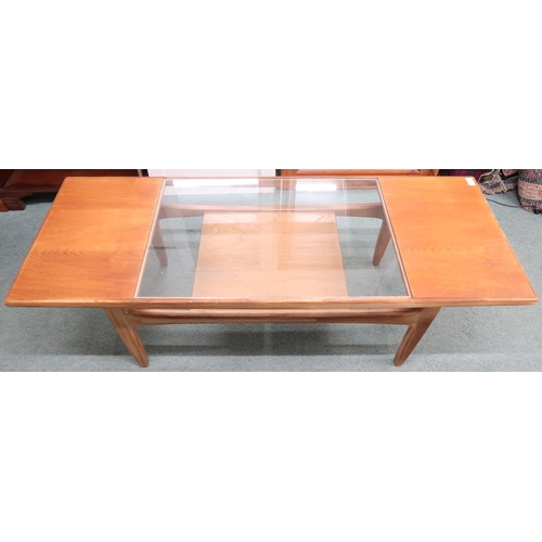 61 - A mid 20th century G Plan teak coffee table with rectangular top with glass insert on shaped support... 