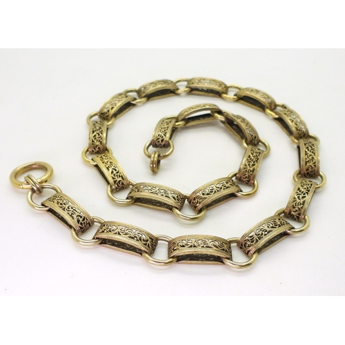 2700 - A VICTORIAN 15CT GOLD CHAINa traditional locket chain, with decorative filigree links, and oversize ... 