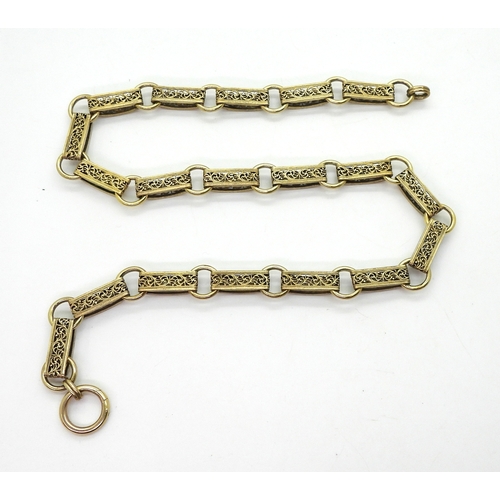 2700 - A VICTORIAN 15CT GOLD CHAINa traditional locket chain, with decorative filigree links, and oversize ... 