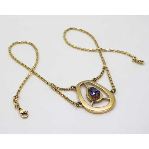 2707 - A 9CT GOLD TANZANITE NECKLACEbespoke made by Greig Thin-Smith of The Goldsmiths Workshop Dumfries, s... 