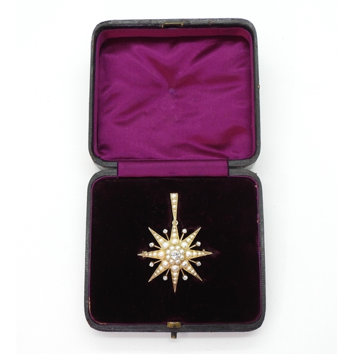 2710 - A VICTORIAN STAR PENDANT BROOCHthe mount in bright yellow metal, set with quality split pearls and o... 