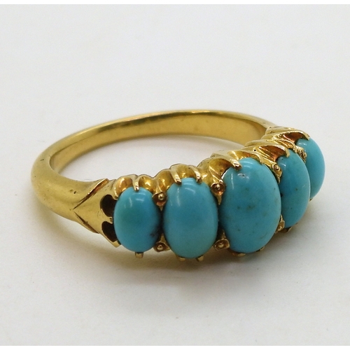 2712 - A TURQUOISE VINTAGE RINGthe classic mount is set  with five oval turquoise gemstones. The large... 