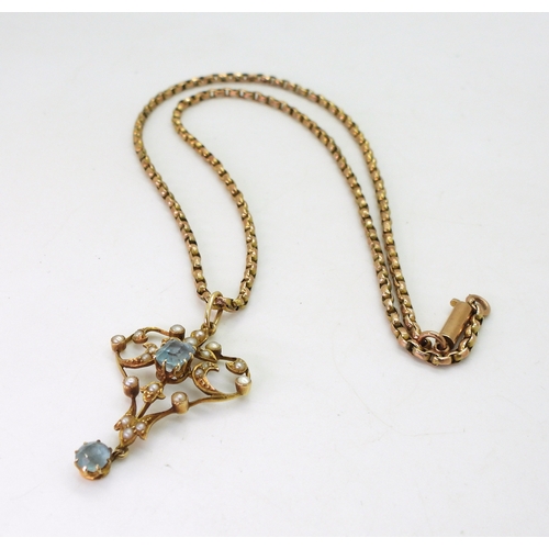 2715 - A 15CT GOLD EDWARDIAN PENDANTset with aquamarine and split pearls, length with bail 4cm, with a vint... 