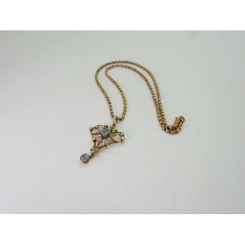 2715 - A 15CT GOLD EDWARDIAN PENDANTset with aquamarine and split pearls, length with bail 4cm, with a vint... 