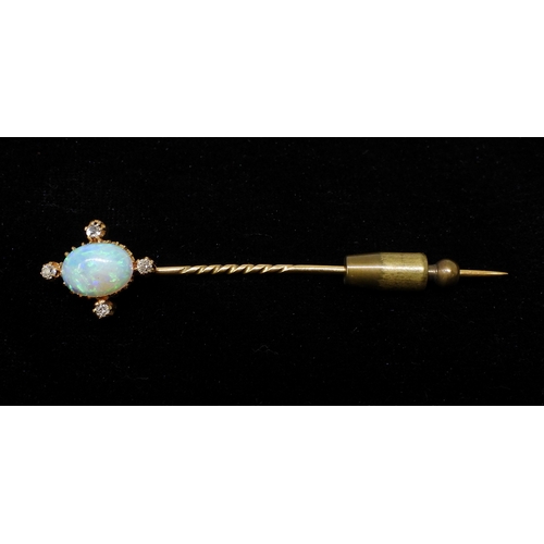 2716 - AN OPAL AND DIAMOND PINset with a lively 10mm x 7mm x 3.5mm opal with four old cut diamond accents. ... 