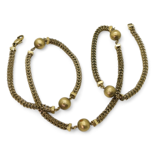 2717 - A 9CT GOLD FANCY CHAINwith textured beads and open herringbone style chain, length 63.5cm... 