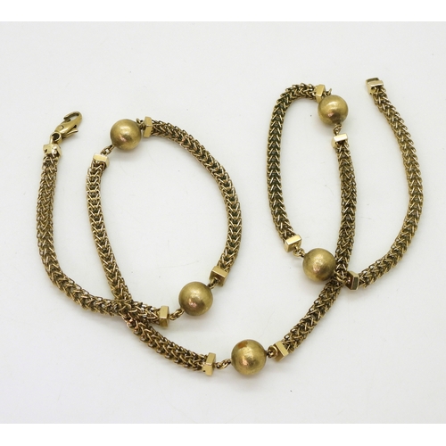 2717 - A 9CT GOLD FANCY CHAINwith textured beads and open herringbone style chain, length 63.5cm... 