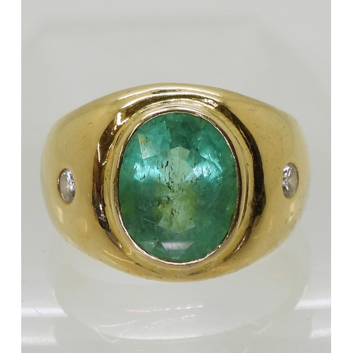 2722 - A GENTS EMERALD & DIAMOND RINGmounted in bright yellow metal, set with a 12mm x 10mm x 7.5mm ova... 