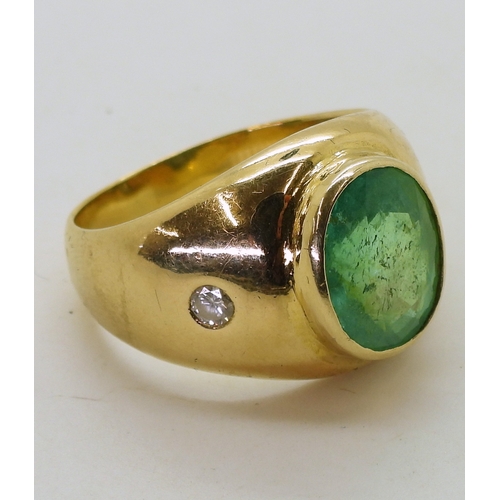 2722 - A GENTS EMERALD & DIAMOND RINGmounted in bright yellow metal, set with a 12mm x 10mm x 7.5mm ova... 