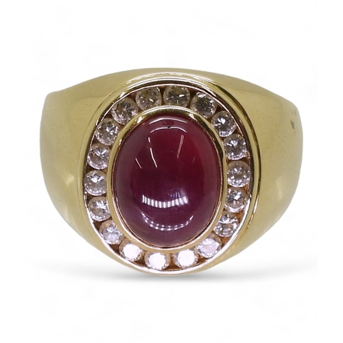 2725 - A GENTS RUBY & DIAMOND RINGmounted in bright yellow metal stamped 750, the cabochon ruby is appr... 