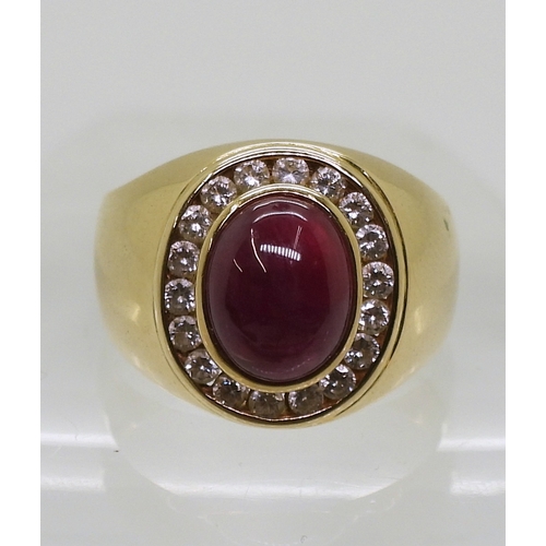 2725 - A GENTS RUBY & DIAMOND RINGmounted in bright yellow metal stamped 750, the cabochon ruby is appr... 