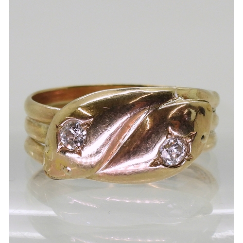 2726 - A 9CT GOLD SNAKE RINGthe double heads are set with 0.28cts of old cut diamonds combined. Chester hal... 