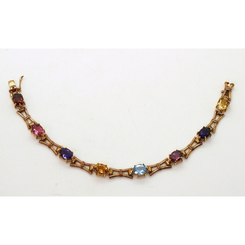 2728 - A MULTI GEM BRACELETmade in 9ct gold by Cropp & Farr, set with oval gemstones to include amethys... 