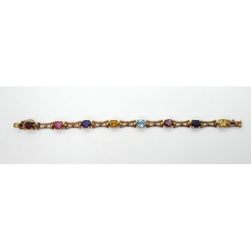 2728 - A MULTI GEM BRACELETmade in 9ct gold by Cropp & Farr, set with oval gemstones to include amethys... 