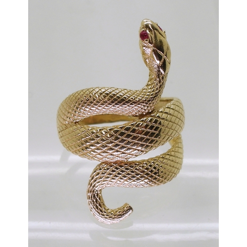 2729 - A 14K GOLD SNAKE RINGthe highly textured snake has ruby eyes, with lasered hallmark 585, finger size... 