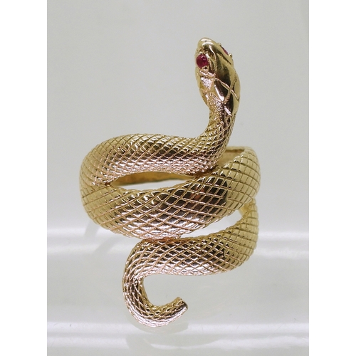 2729 - A 14K GOLD SNAKE RINGthe highly textured snake has ruby eyes, with lasered hallmark 585, finger size... 