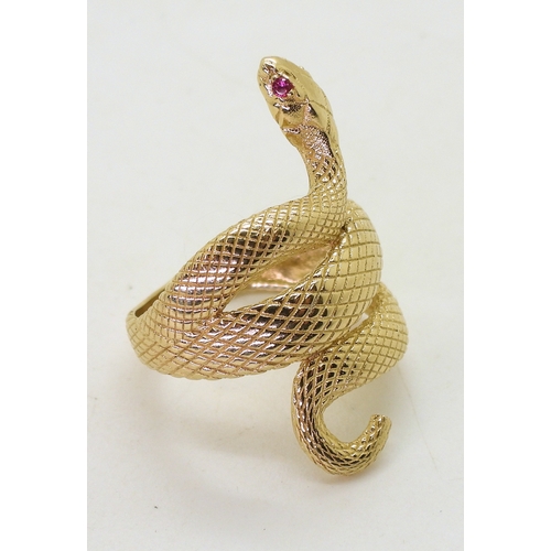 2729 - A 14K GOLD SNAKE RINGthe highly textured snake has ruby eyes, with lasered hallmark 585, finger size... 