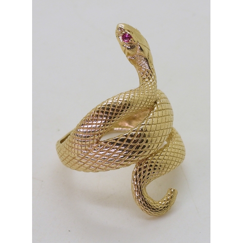 2729 - A 14K GOLD SNAKE RINGthe highly textured snake has ruby eyes, with lasered hallmark 585, finger size... 