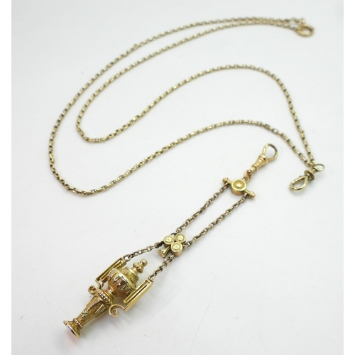 2733 - A VINTAGE GUARD CHAIN & PENDANT FOBthe pendant fob in three colour gold with urn design, faintly... 