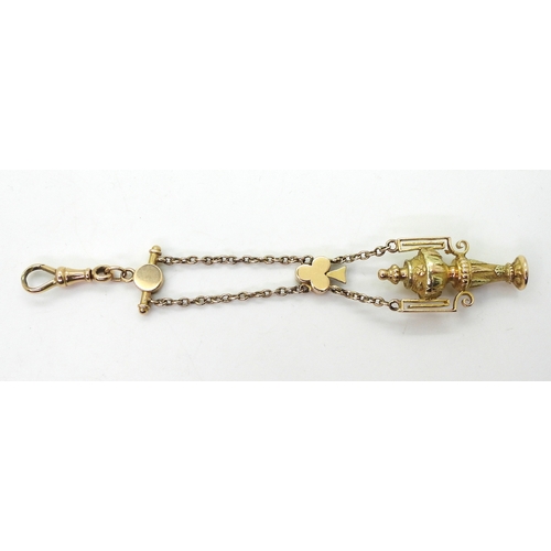 2733 - A VINTAGE GUARD CHAIN & PENDANT FOBthe pendant fob in three colour gold with urn design, faintly... 