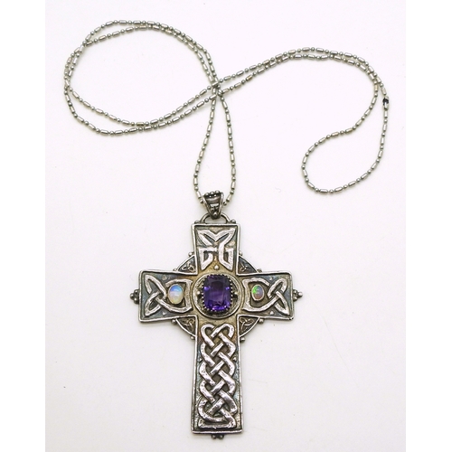 2739 - AN ARTS & CRAFTS CELTIC CROSSthe handmade white metal cross is hand chased with Celtic knotwork,... 