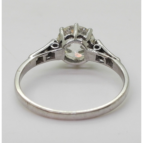 2744 - A VINTAGE DIAMOND SOLITAIRE RINGthe white metal mount is set with an old cut diamond of estimated ap... 