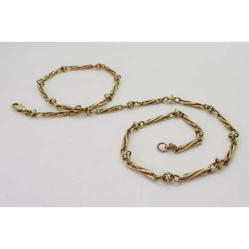 2745 - A 9CT GOLD FANCY CHAINwith twisted baton links. Length 52cm, weight 18.3gms