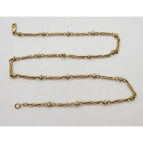 2745 - A 9CT GOLD FANCY CHAINwith twisted baton links. Length 52cm, weight 18.3gms