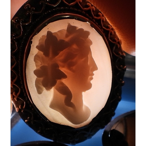 2749 - CONCH SHELL CAMEOSthe well carved cameo of a follower of Bacchus is mounted in a decorative gilded w... 