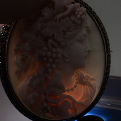 2749 - CONCH SHELL CAMEOSthe well carved cameo of a follower of Bacchus is mounted in a decorative gilded w... 