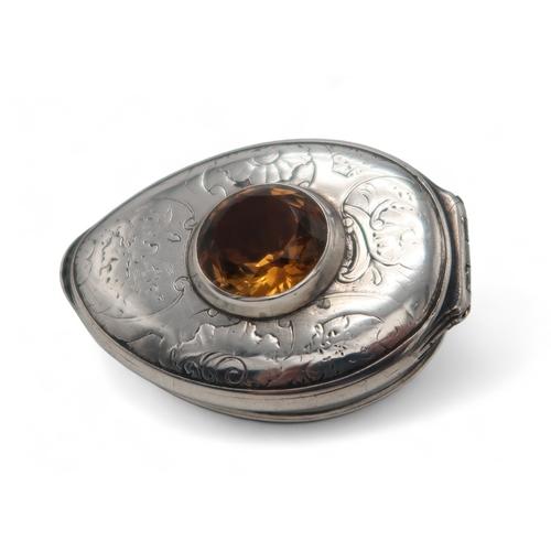 2500 - AN UNUSUAL SCOTTISH SILVER-MOUNTED COWRIE SHELL SNUFF BOXunmarked, inset with an amber cairngorm to ... 