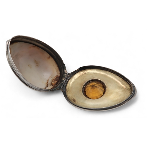 2500 - AN UNUSUAL SCOTTISH SILVER-MOUNTED COWRIE SHELL SNUFF BOXunmarked, inset with an amber cairngorm to ... 