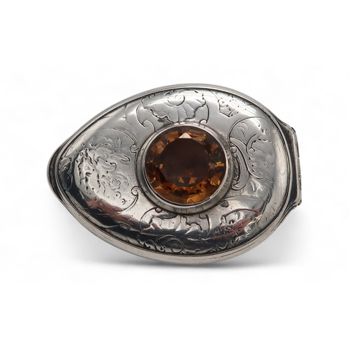 2500 - AN UNUSUAL SCOTTISH SILVER-MOUNTED COWRIE SHELL SNUFF BOXunmarked, inset with an amber cairngorm to ... 