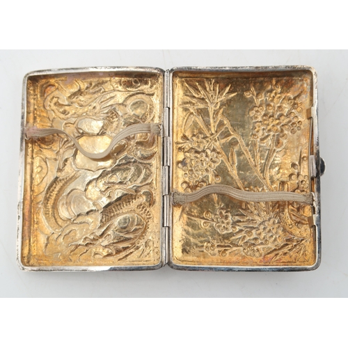 2502 - A CHINESE EXPORT SILVER CIGARETTE CASEby Wing Nam & Co, of rectangular form, decorated to the fr... 