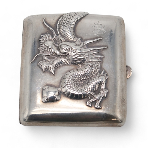 2503 - A CHINESE EXPORT SILVER CIGARETTE CASEmaker's mark C J Co, of rectangular form, decorated in relief ... 