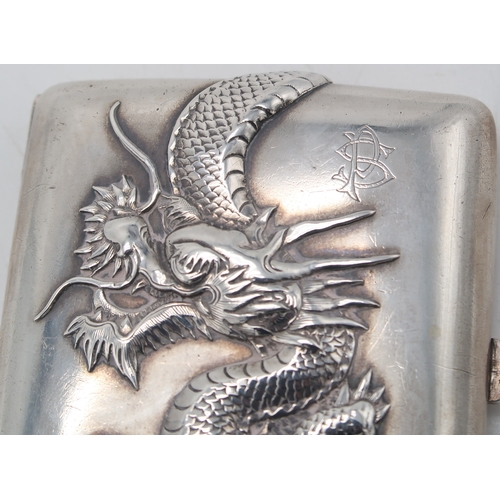 2503 - A CHINESE EXPORT SILVER CIGARETTE CASEmaker's mark C J Co, of rectangular form, decorated in relief ... 