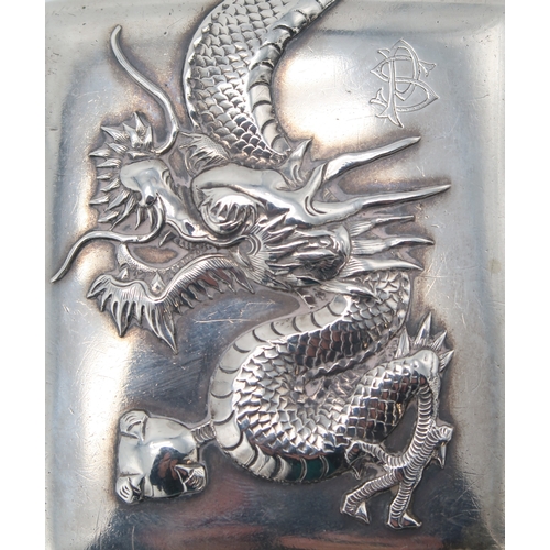 2503 - A CHINESE EXPORT SILVER CIGARETTE CASEmaker's mark C J Co, of rectangular form, decorated in relief ... 